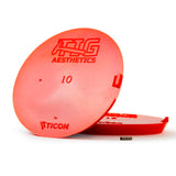 Two large red silicone purge plugs for high purity tube welding with mesh diffuser for laminar argon flow and small tube to attach hose
