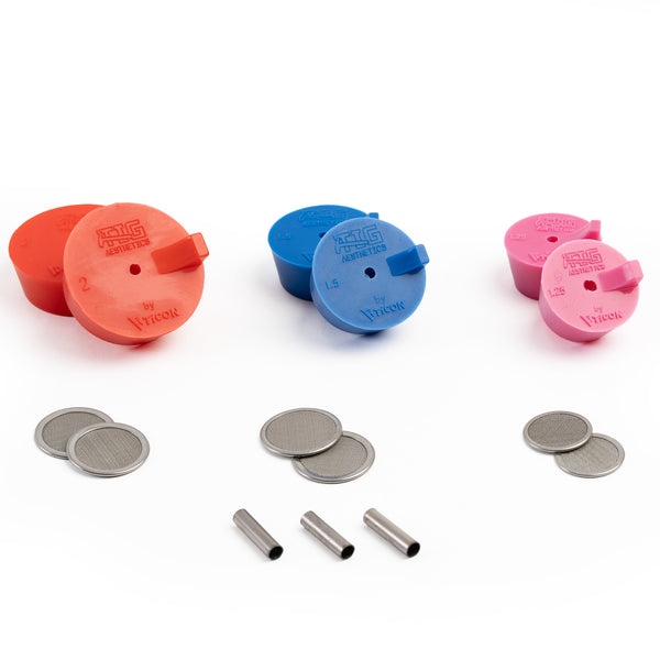 An assortment of silicone purge plugs in red 2.0", blue 1.5", and pink 1.25" schedule nominal pipe with stainless steel mesh diffusers and titanium argon inlet tubes. for high purity turbo manifold fabrication