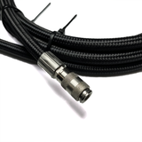 A 10-foot long coiled black Ultra Flex High PSI braided hose with pre-crimped quick disconnect fittings zoom view of hose and one female fitting.