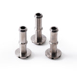 Three pieces of raw titanium shower head diffusers with finger prints and  precision CNC machined outlet ports, displayed against a white background with TIG Aesthetics and Ticon logo laser etched on the bottom.