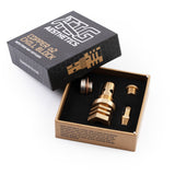 a single black product packaging open box containing and showing m18 tellurium copper chill block with included accessories honeycomb pattern with gold and white TIG Aesthetics branding and description