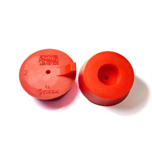 Two red silicone purge plugs for high purity tube welding with mesh diffuser for laminar argon flow and small tube to attach hose
