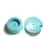 Two light blue silicone purge plugs for high purity tube welding with mesh diffuser for laminar argon flow and small tube to attach hose