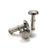 Three pieces of raw titanium shower head diffusers with precision CNC machined outlet ports, displayed against a white background with TIG Aesthetics and Ticon logo laser etched on the bottom.