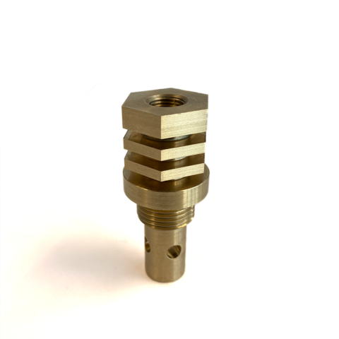 A Copper bronze colored copper chill block designed for use in welding with an M18 O2 bung on white background not installed